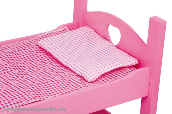 Lieferung inklusive rosa karierter Bettwäsche.